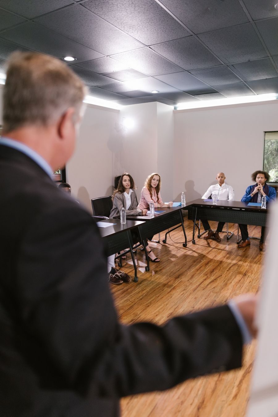 A diverse team discussing strategy around a bright conference table